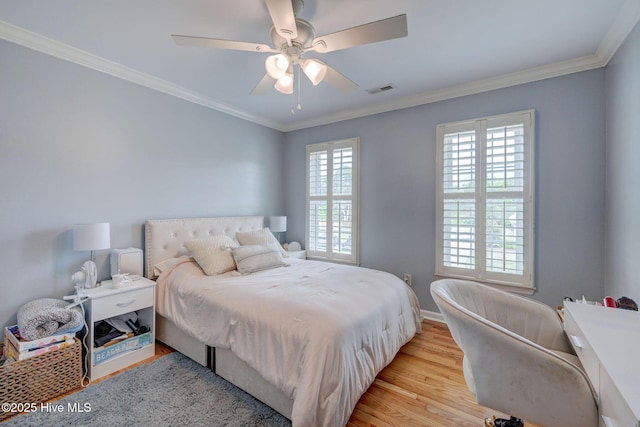 809 Berwyn Rd, Wilmington, NC 28409 - bedroom featuring light wood finished floors, ornamental molding, baseboards, and ceiling fan