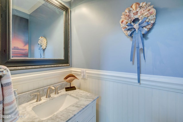 809 Berwyn Rd, Wilmington, NC 28409 - bathroom featuring a wainscoted wall and vanity