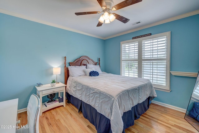 809 Berwyn Rd, Wilmington, NC 28409 - bedroom featuring wood finished floors, baseboards, crown molding, and ceiling fan