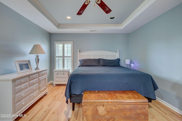 809 Berwyn Rd, Wilmington, NC 28409 - bedroom featuring a raised ceiling, light wood-style flooring, crown molding, baseboards, and ceiling fan
