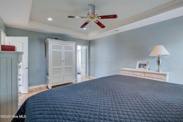 809 Berwyn Rd, Wilmington, NC 28409 - bedroom featuring wood finished floors, a tray ceiling, ornamental molding, baseboards, and recessed lighting