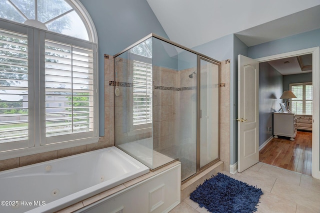 809 Berwyn Rd, Wilmington, NC 28409 - full bathroom featuring a shower stall, tile patterned flooring, a whirlpool tub, and lofted ceiling