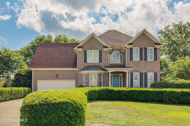 809 Berwyn Rd, Wilmington, NC 28409 - view of front of property featuring concrete driveway, a front yard, and brick siding