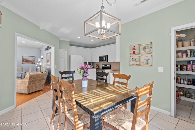 1434 Wagon Ct, Wilmington, NC 28412 - dining space with light tile patterned flooring, crown molding, a chandelier, recessed lighting, and baseboards