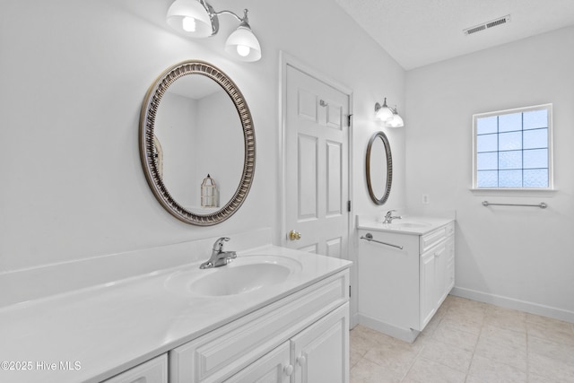 1434 Wagon Ct, Wilmington, NC 28412 - full bathroom with two vanities, baseboards, and tile patterned flooring