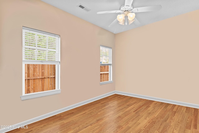 1434 Wagon Ct, Wilmington, NC 28412 - unfurnished room featuring wood finished floors, baseboards, and ceiling fan