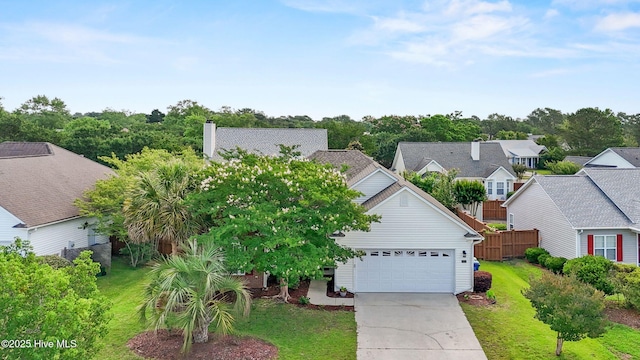 1434 Wagon Ct, Wilmington, NC 28412 - view of front facade featuring driveway, an attached garage, and a residential view