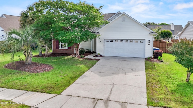 1434 Wagon Ct, Wilmington, NC 28412 - view of front of home featuring a garage, concrete driveway, and brick siding