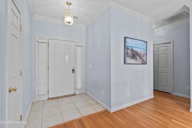 1434 Wagon Ct, Wilmington, NC 28412 - foyer with baseboards, ornamental molding, and light wood-type flooring