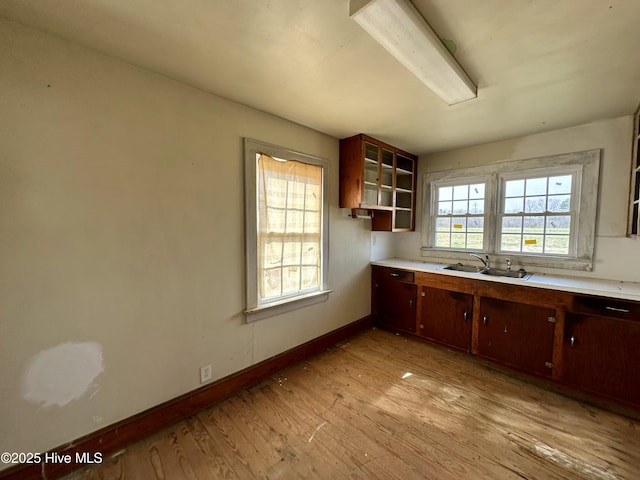 718 Beasley Rd, Roper, NC 27970 - kitchen with a sink, light wood finished floors, light countertops, baseboards, and open shelves