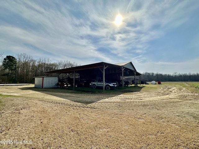 718 Beasley Rd, Roper, NC 27970 - view of outbuilding with a carport and driveway