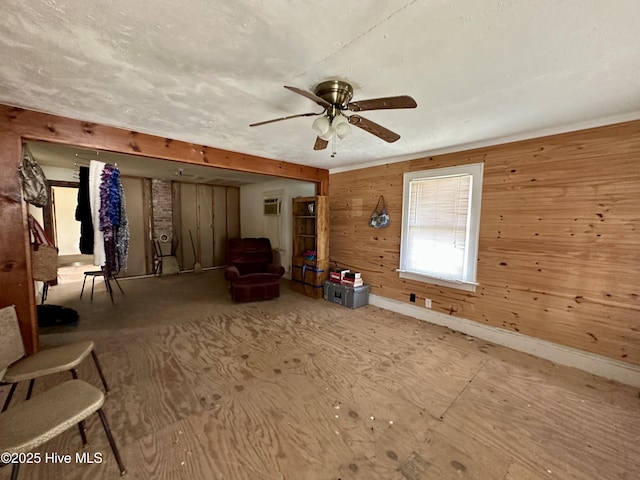 718 Beasley Rd, Roper, NC 27970 - unfurnished room featuring ceiling fan, wooden walls, baseboards, and a wall mounted air conditioner
