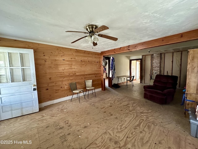 718 Beasley Rd, Roper, NC 27970 - sitting room with ceiling fan and wood walls