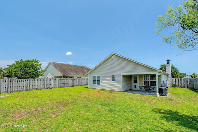 443 Foxfield Ct, Wilmington, NC 28411 - rear view of house with a patio and a chimney