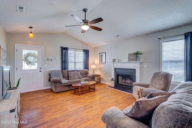 443 Foxfield Ct, Wilmington, NC 28411 - living room with light wood-style flooring, ceiling fan, a fireplace with flush hearth, healthy amount of natural light, and lofted ceiling