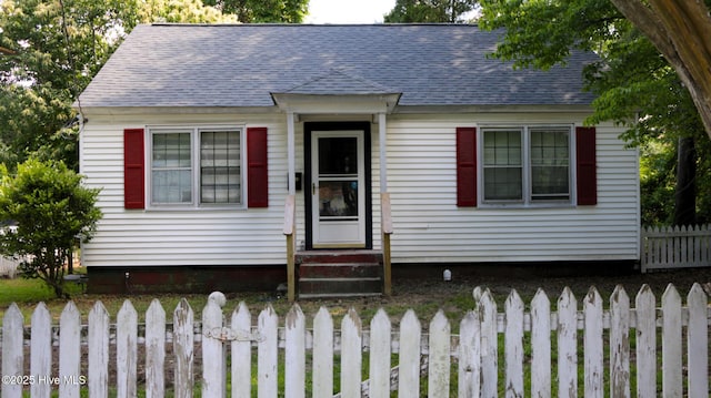 1817 Asheville St, New Bern, NC 28560 - view of front of house featuring a fenced front yard and a shingled roof