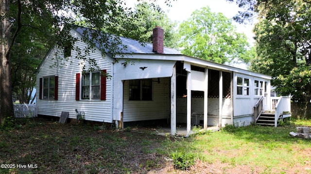 1817 Asheville St, New Bern, NC 28560 - back of house featuring a chimney and a wooden deck