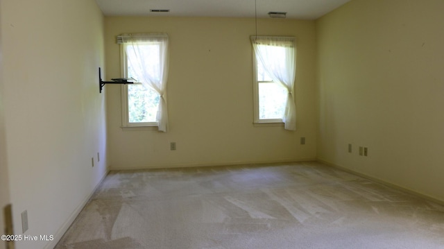 1819 Caracara Dr, New Bern, NC 28560 - carpeted empty room featuring healthy amount of natural light and baseboards