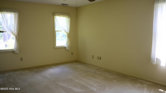 1819 Caracara Dr, New Bern, NC 28560 - unfurnished room featuring a ceiling fan, healthy amount of natural light, carpet floors, and baseboards