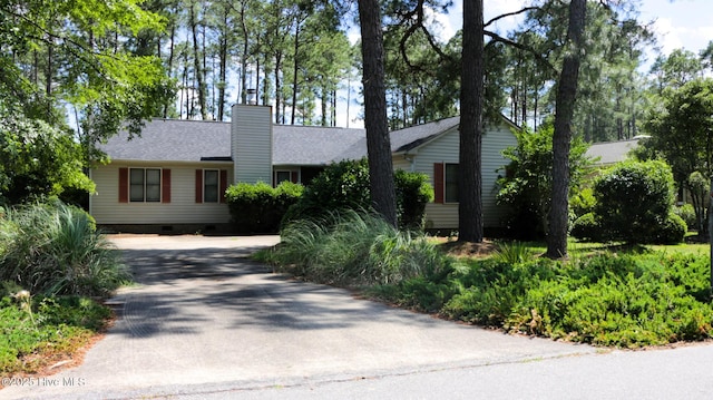 1819 Caracara Dr, New Bern, NC 28560 - ranch-style house with crawl space, concrete driveway, a chimney, and roof with shingles