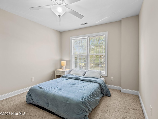 98 Mccain Ln Unit 3, Swansboro, NC 28584 - carpeted bedroom featuring baseboards and ceiling fan