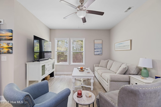 210 N Stingray Ln, Sneads Ferry, NC 28460 - living area with ceiling fan, wood finished floors, and baseboards