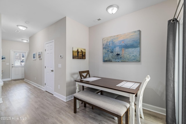 210 N Stingray Ln, Sneads Ferry, NC 28460 - dining room featuring light wood finished floors and baseboards