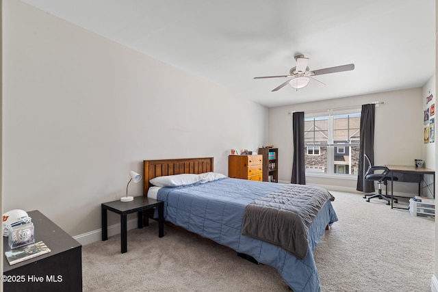 210 N Stingray Ln, Sneads Ferry, NC 28460 - carpeted bedroom with baseboards and a ceiling fan