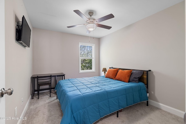 210 N Stingray Ln, Sneads Ferry, NC 28460 - carpeted bedroom with baseboards and ceiling fan