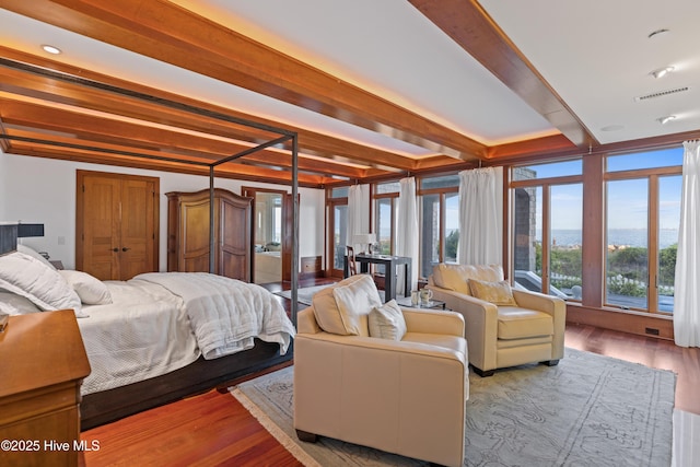 218 Row Boat Row, Bald Head Island, NC 28461 - bedroom featuring beamed ceiling and wood finished floors