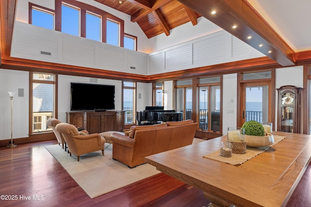 218 Row Boat Row, Bald Head Island, NC 28461 - living area with high vaulted ceiling, wood finished floors, wooden ceiling with exposed beams, and recessed lighting