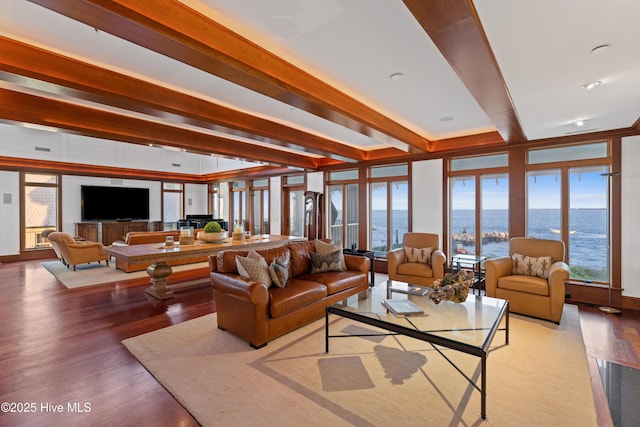 218 Row Boat Row, Bald Head Island, NC 28461 - living area featuring a water view, wood finished floors, healthy amount of natural light, and beamed ceiling