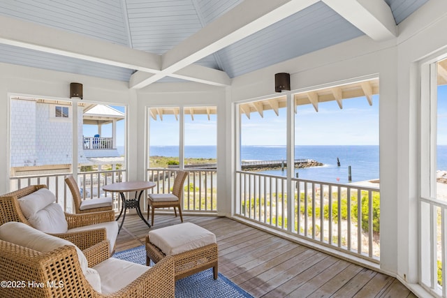 218 Row Boat Row, Bald Head Island, NC 28461 - sunroom / solarium with a water view, beamed ceiling, hardwood / wood-style flooring, and plenty of natural light