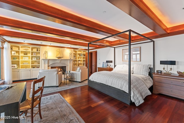 218 Row Boat Row, Bald Head Island, NC 28461 - bedroom with beam ceiling, wood finished floors, and a fireplace