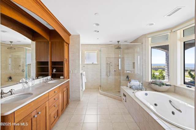 218 Row Boat Row, Bald Head Island, NC 28461 - full bathroom featuring a shower stall, a tub with jets, tile patterned floors, and double vanity