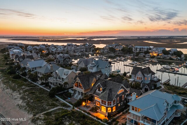 218 Row Boat Row, Bald Head Island, NC 28461 - aerial perspective of suburban area with a nearby body of water