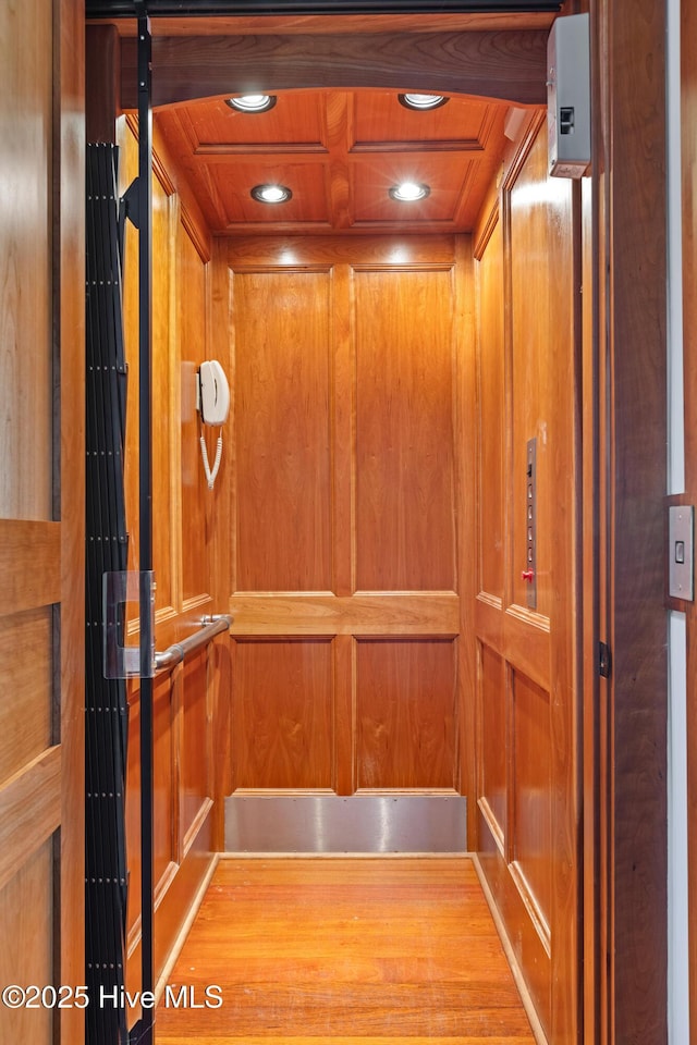 218 Row Boat Row, Bald Head Island, NC 28461 - elevator featuring recessed lighting, wood ceiling, and wood walls