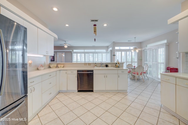 7120 Orchard Trce, Wilmington, NC 28409 - kitchen with freestanding refrigerator, dishwasher, ceiling fan, light countertops, and recessed lighting