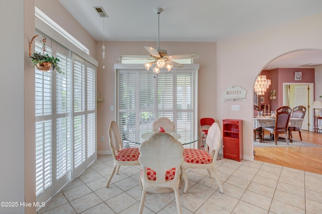 7120 Orchard Trce, Wilmington, NC 28409 - dining area featuring arched walkways, plenty of natural light, light tile patterned floors, and a ceiling fan
