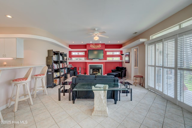 7120 Orchard Trce, Wilmington, NC 28409 - living room with light tile patterned floors, ceiling fan, a fireplace, and recessed lighting