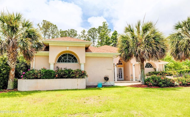 7120 Orchard Trce, Wilmington, NC 28409 - mediterranean / spanish home with a front yard and stucco siding