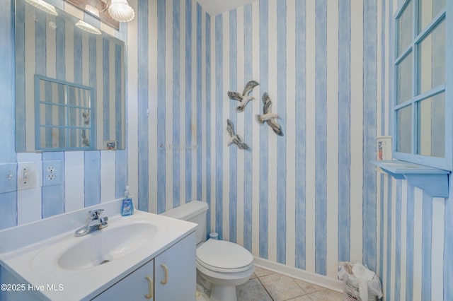 7120 Orchard Trce, Wilmington, NC 28409 - half bathroom with tile patterned floors, toilet, vanity, and baseboards