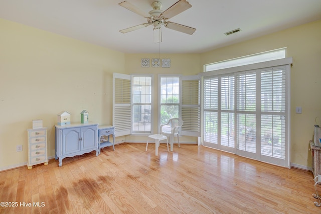 7120 Orchard Trce, Wilmington, NC 28409 - living area featuring a ceiling fan, wood finished floors, and baseboards