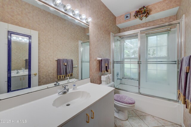 7120 Orchard Trce, Wilmington, NC 28409 - bathroom featuring toilet, enclosed tub / shower combo, vanity, wallpapered walls, and tile patterned flooring