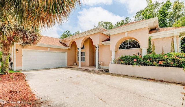 7120 Orchard Trce, Wilmington, NC 28409 - mediterranean / spanish home with driveway, stucco siding, and a garage