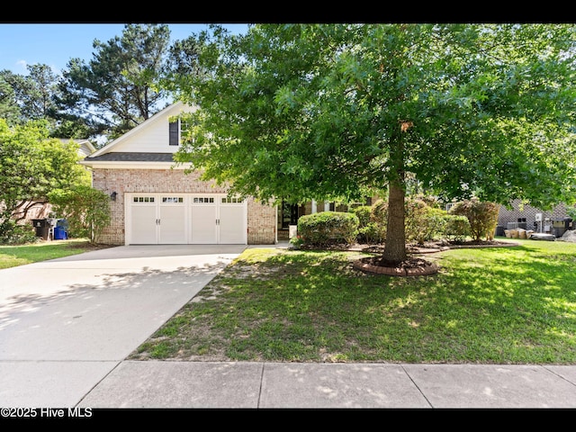 822 Lambrook Dr, Wilmington, NC 28411 - view of property hidden behind natural elements featuring brick siding, concrete driveway, a garage, and a front yard