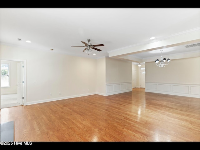 822 Lambrook Dr, Wilmington, NC 28411 - unfurnished living room with a chandelier, crown molding, ceiling fan, light wood-style floors, and a decorative wall