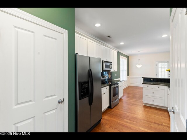 822 Lambrook Dr, Wilmington, NC 28411 - kitchen with stainless steel appliances, dark countertops, white cabinetry, recessed lighting, and ornamental molding