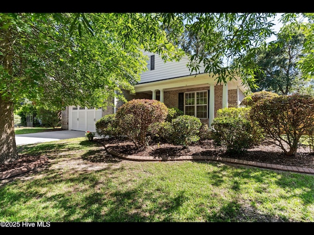 822 Lambrook Dr, Wilmington, NC 28411 - obstructed view of property with brick siding and a front lawn
