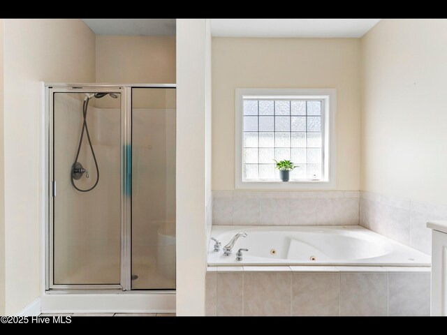 822 Lambrook Dr, Wilmington, NC 28411 - full bathroom featuring a shower stall and a jetted tub